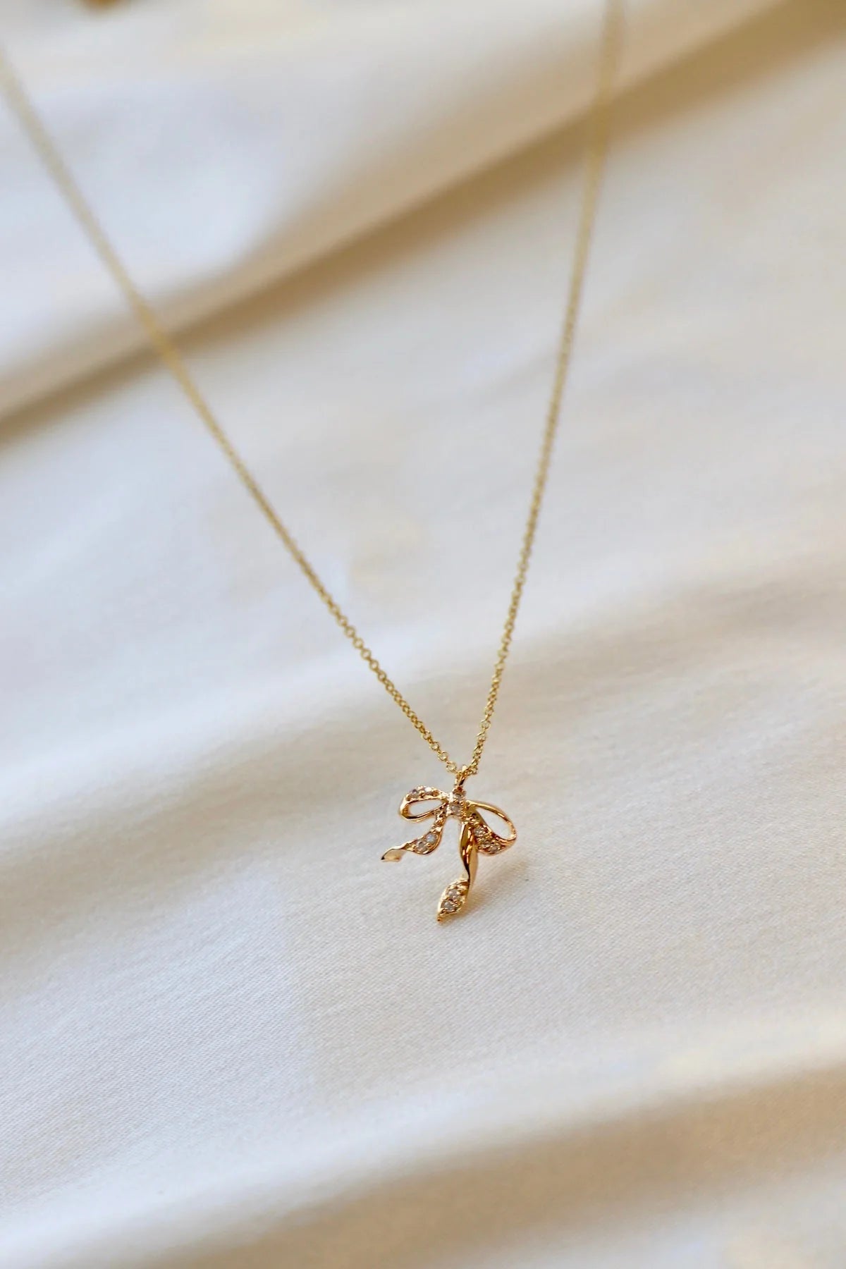 SILVER CZ BOW NECKLACE