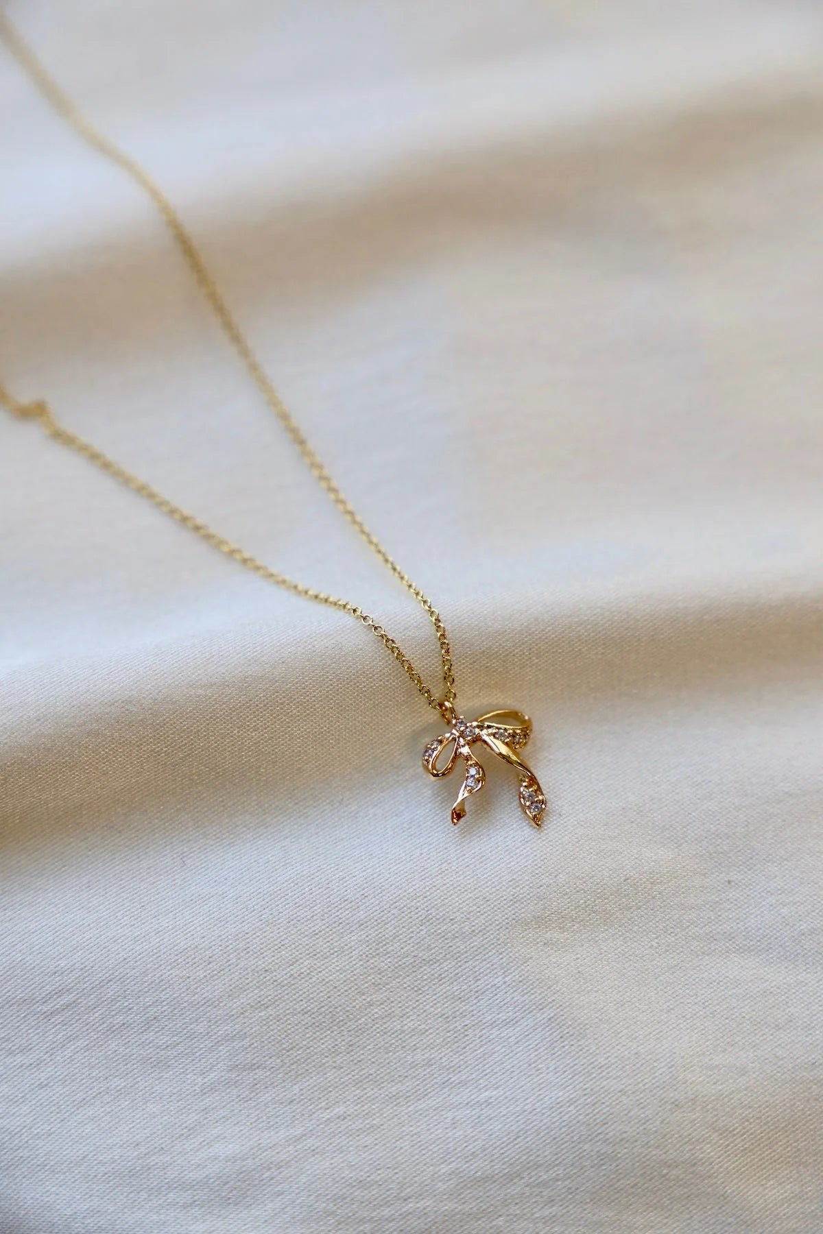 SILVER CZ BOW NECKLACE